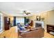 Cozy living room with hardwood floors, fireplace, and comfortable seating at 13661 Smokey Ridge Pl, Carmel, IN 46033