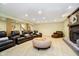 Spacious living room featuring a brick fireplace, plush seating, recessed lighting, and carpeted floor at 13661 Smokey Ridge Pl, Carmel, IN 46033