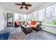 Bright sunroom with slate floors, lots of windows and comfortable seating at 13661 Smokey Ridge Pl, Carmel, IN 46033