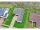Aerial view of a home with a well-kept lawn, long driveway, and neatly arranged landscaping at 14242 Brandt Ln, Carmel, IN 46074
