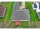 Top-down aerial view of a home showing roof condition, and backyard deck surrounded by healthy green lawn at 14242 Brandt Ln, Carmel, IN 46074