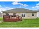 The property features a generous green backyard with a spacious deck ideal for outdoor entertainment at 14242 Brandt Ln, Carmel, IN 46074