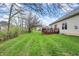 Expansive lawn with a spacious deck offers room to enjoy the outdoors at 14242 Brandt Ln, Carmel, IN 46074