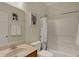 Clean bathroom features a shower with a white shower curtain, vanity, and framed artwork at 14242 Brandt Ln, Carmel, IN 46074