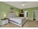 Spacious bedroom featuring a white bed frame and views of an ensuite bathroom and a closet at 14242 Brandt Ln, Carmel, IN 46074