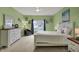 Bright bedroom with white furniture, a comfortable chair and a large window, providing ample natural light at 14242 Brandt Ln, Carmel, IN 46074