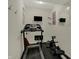Compact exercise room equipped with a treadmill and rowing machine, perfect for staying active at home at 14242 Brandt Ln, Carmel, IN 46074