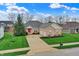 Well-maintained home featuring a brick facade and a spacious two-car garage at 14242 Brandt Ln, Carmel, IN 46074