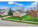 A charming single-story brick and siding home with a well-manicured lawn at 14242 Brandt Ln, Carmel, IN 46074