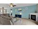 Inviting living room featuring a fireplace, plush sectional sofa, neutral walls, and bright windows at 14242 Brandt Ln, Carmel, IN 46074