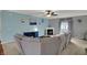 Bright living room with a corner fireplace, plush sectional sofa, ceiling fan, and soft paint at 14242 Brandt Ln, Carmel, IN 46074