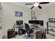 Home office with glass desk, multiple monitors, and ample workspace for productivity at 14242 Brandt Ln, Carmel, IN 46074