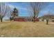 Expansive backyard with patio, sunroom, and lush lawn, perfect for outdoor entertaining at 15247 E 191St St, Noblesville, IN 46060