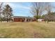 Large backyard featuring an enclosed sunroom and brick patio at the back of the home at 15247 E 191St St, Noblesville, IN 46060