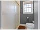 Bathroom featuring walk in shower with seamless glass doors and neutral wall color at 15247 E 191St St, Noblesville, IN 46060