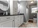 Updated bathroom with dual sinks, granite countertops, and a glass shower at 15247 E 191St St, Noblesville, IN 46060