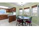 Charming dining area with bright windows, stylish decor, and views of the green, outdoor scenery at 15247 E 191St St, Noblesville, IN 46060