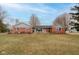 Charming brick ranch-style home features an inviting entrance and a well-manicured front lawn at 15247 E 191St St, Noblesville, IN 46060