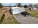 Spacious detached garage with a truck parked outside on a gravel driveway at 15247 E 191St St, Noblesville, IN 46060