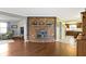 Inviting living space with a brick fireplace, hardwood floors, and open access to the updated kitchen at 15247 E 191St St, Noblesville, IN 46060