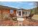 Charming outdoor patio with wicker seating and access to a bright sunroom addition at 15247 E 191St St, Noblesville, IN 46060