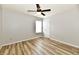 Bright bedroom boasts modern vinyl plank flooring, a ceiling fan, and a white door at 15281 Proud Truth Dr, Noblesville, IN 46060