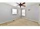 Bedroom featuring neutral-toned walls, two windows with blinds, and a ceiling fan at 15281 Proud Truth Dr, Noblesville, IN 46060