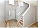Open entryway featuring wood-style vinyl flooring, stairs, and a bright, welcoming atmosphere at 15281 Proud Truth Dr, Noblesville, IN 46060