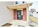 Inviting front porch with brick accents, bench, and plants at 15281 Proud Truth Dr, Noblesville, IN 46060