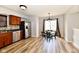 Open-concept kitchen featuring stainless steel appliances and a dining area with a modern chandelier at 15281 Proud Truth Dr, Noblesville, IN 46060