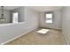 Neutral toned living room features a modern light fixture and bright sunlight at 15281 Proud Truth Dr, Noblesville, IN 46060