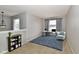 Bright living room features stylish decor, a large window, and a comfortable seating area at 15281 Proud Truth Dr, Noblesville, IN 46060