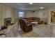 Finished basement features a fireplace, large sectional sofa and plenty of room for entertaining at 1612 Westbay Ct, Indianapolis, IN 46260