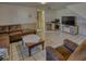 Finished basement space with a large sectional sofa, coffee table and entertainment center at 1612 Westbay Ct, Indianapolis, IN 46260