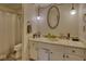 Bathroom featuring a single sink with white cabinets, mirror, and modern lighting and bathtub at 1612 Westbay Ct, Indianapolis, IN 46260
