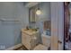 Small bathroom featuring a single sink, white cabinets, and a toilet at 1612 Westbay Ct, Indianapolis, IN 46260