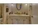 Bathroom featuring a single sink with white cabinets, mirror, and modern lighting at 1612 Westbay Ct, Indianapolis, IN 46260