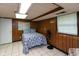 Cozy bedroom with paneled walls, tiled floor and comfortable queen size bed at 1612 Westbay Ct, Indianapolis, IN 46260