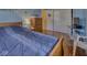 Cozy bedroom with hardwood floors, a comfortable bed, and closet access at 1612 Westbay Ct, Indianapolis, IN 46260