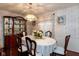 Well-appointed dining room with hardwood floors, china cabinet, and coordinated decor at 1612 Westbay Ct, Indianapolis, IN 46260