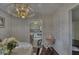 Cozy dining room with hardwood floors and chandelier lighting at 1612 Westbay Ct, Indianapolis, IN 46260