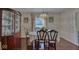 Elegant dining room featuring hardwood floors, classic furnishings, and ample natural light for memorable meals at 1612 Westbay Ct, Indianapolis, IN 46260