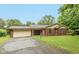Charming single-story brick home with attached garage and mature trees at 1612 Westbay Ct, Indianapolis, IN 46260