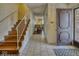 The foyer showcases stairs, tile flooring, and a glimpse into the living area at 1612 Westbay Ct, Indianapolis, IN 46260