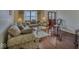Comfortable living room boasts hardwood floors, large windows, and an inviting seating arrangement for relaxing at 1612 Westbay Ct, Indianapolis, IN 46260