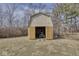 Shed on the property with open doors revealing a lawnmower parked inside at 1612 Westbay Ct, Indianapolis, IN 46260