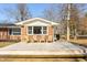 Wooden deck with chairs, features a brick home with great sunlight at 1621 Nottingham Dr, Indianapolis, IN 46240