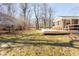 Lawn with a house, features a large yard, a deck and great sunlight at 1621 Nottingham Dr, Indianapolis, IN 46240