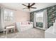 Bright bedroom featuring playful dinosaur wallpaper and a cozy daybed with convenient storage drawers at 1621 Nottingham Dr, Indianapolis, IN 46240