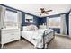 Cozy main bedroom with natural light, dresser storage, ceiling fan, and plush carpet at 1621 Nottingham Dr, Indianapolis, IN 46240